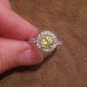 Yellow stone ring with diamonds